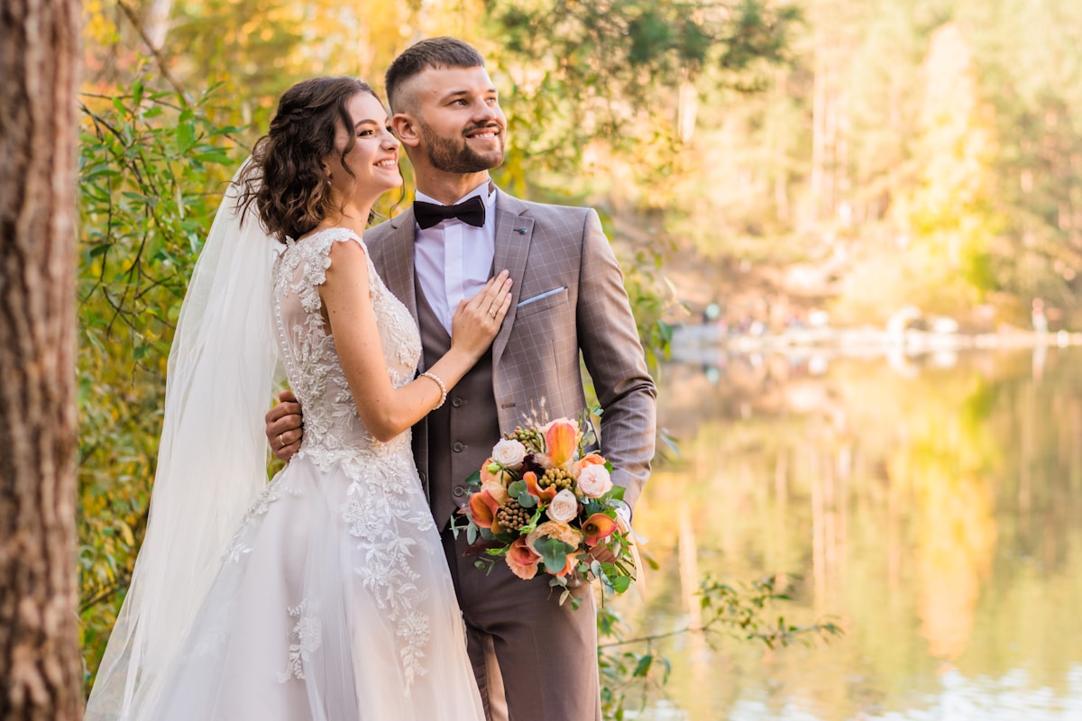 Bride and groom by the water